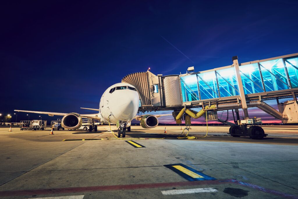 Exterior of a plane at an airport at night