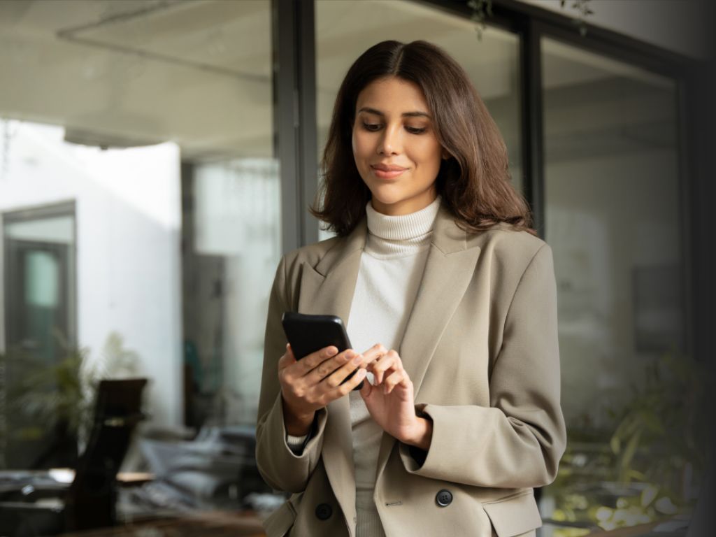 Businesswoman using her smartphone